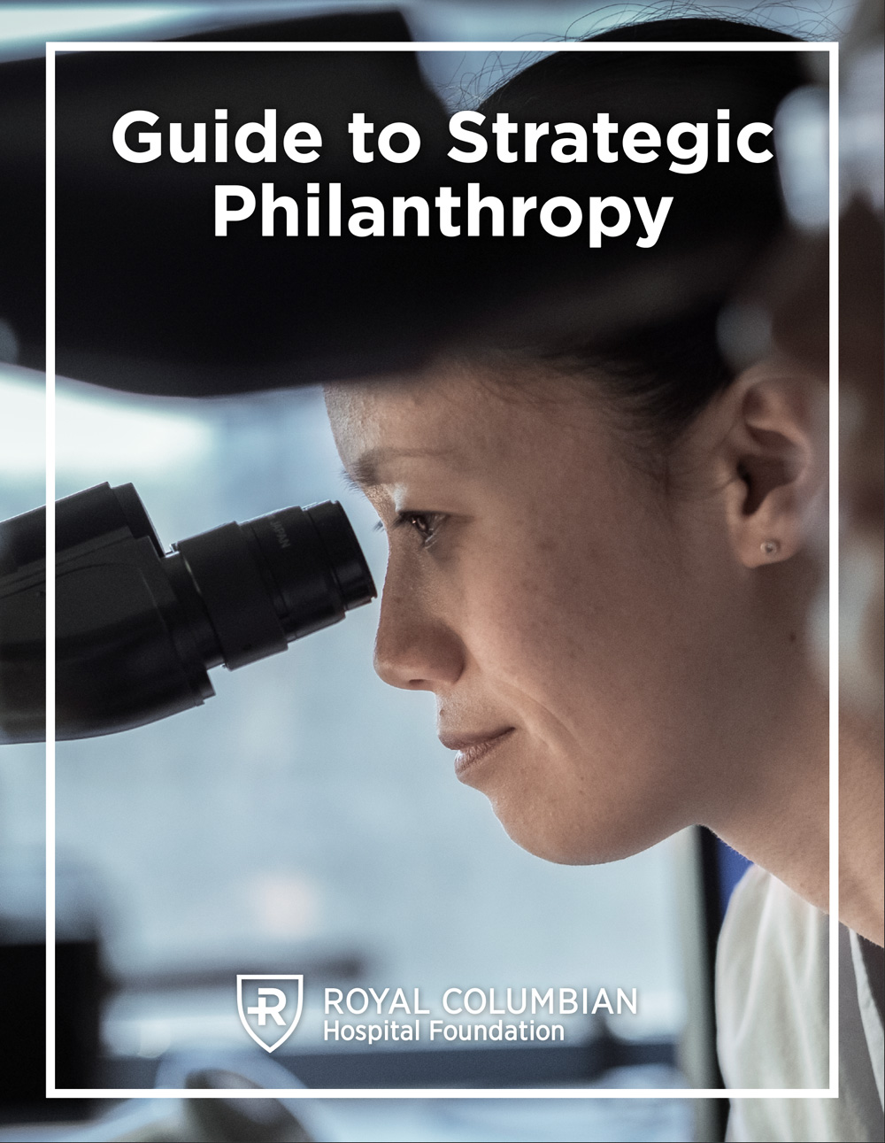 Photo of a doctor looking into a microscope, with the words Guide to Strategic Philanthropy overlayed